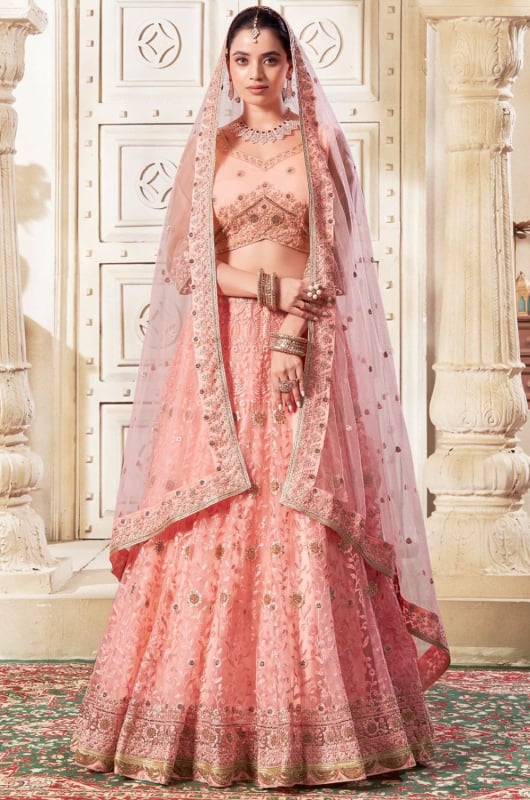 Coral Pink Embroidered Net Designer Lehenga Choli