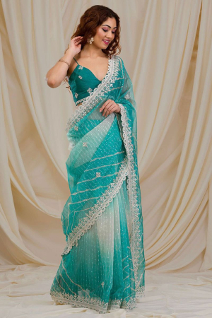 Rama Green and Off White Embroidered Georgette Saree